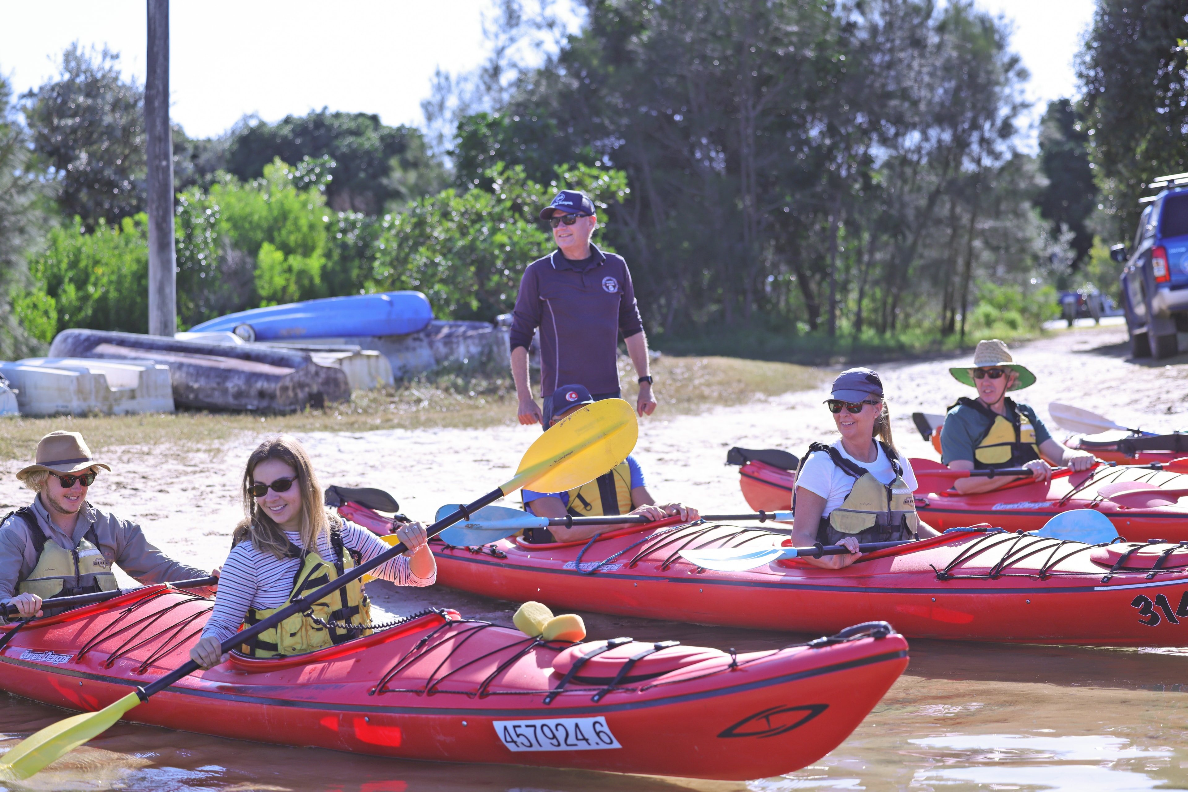 Guided kayak tour on a coastal estuary at morning light